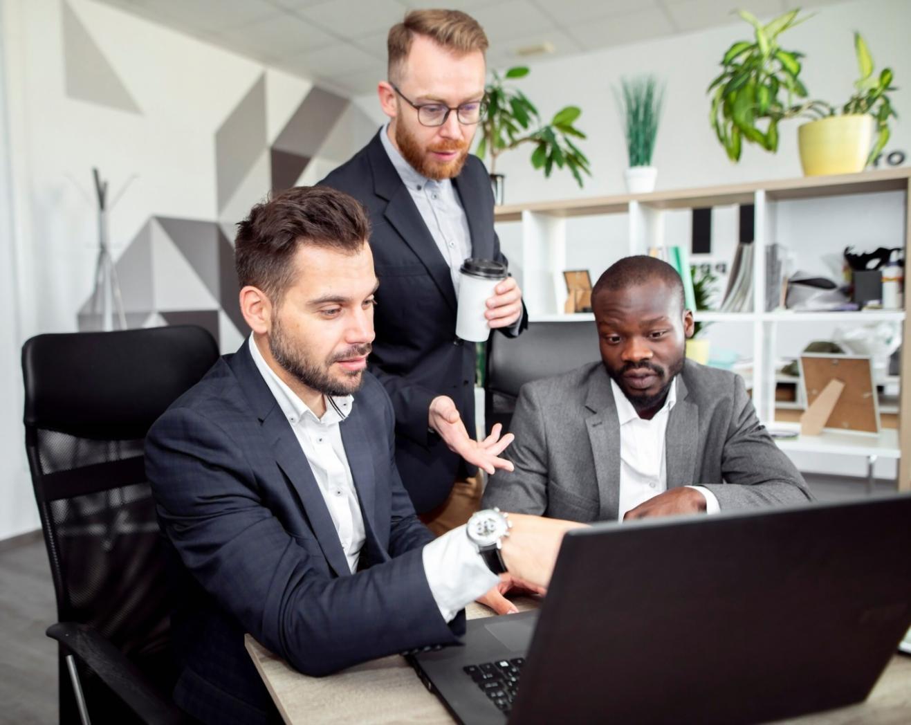 Workshop participants reviewing budget documentation and discussing project cost scenarios at ariontalyxos training session